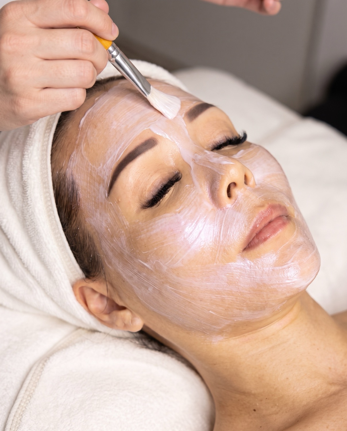 Collagen mask being applied during a Collagen Lifting session